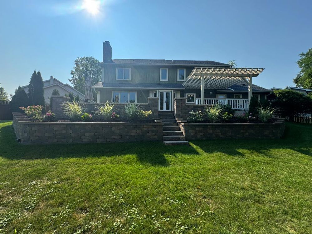 Our Retaining Wall Construction service provides homeowners with durable, aesthetically pleasing solutions to prevent soil erosion, optimize land use, and enhance landscape design with expert craftsmanship tailored to your specific needs. for Alvarez Pavingstone INC. in Lyons, IL