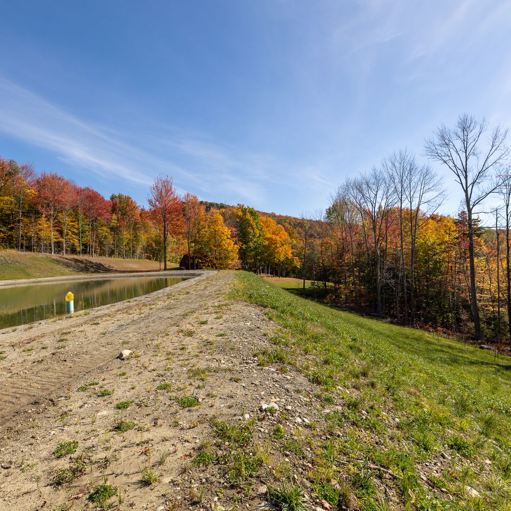 Carving a Pond into a Mountain Side for Andy Naylor Excavation in Stowe, VT