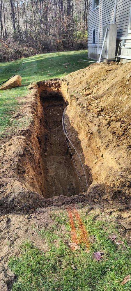 Our professional trenching service ensures precise and efficient digging for utility lines or drainage systems, enhancing your property's infrastructure while prioritizing safety, accuracy, and minimal disruption to your landscape. for Divine Dirt Work in Worcester, MA