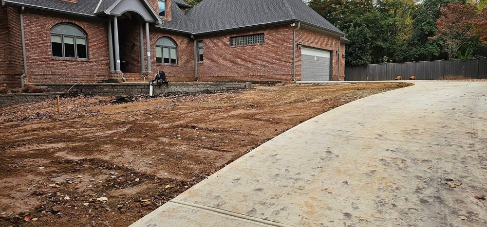 Our Land Grading service expertly levels your yard, ensuring proper drainage and preparing the perfect foundation for landscaping projects while efficiently removing any obstacles like tree stumps to enhance your outdoor space. for The Grand Design in Raleigh, NC