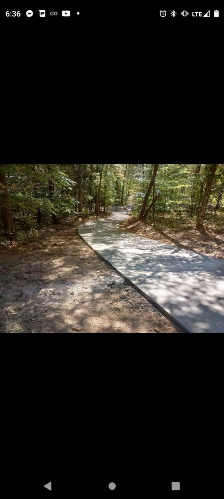 Our Driveways service offers durable and visually appealing concrete options to enhance the curb appeal of your home. Choose from various finishes and colors to suit your personal style. for Dream Team Concrete in Clarkville, TN