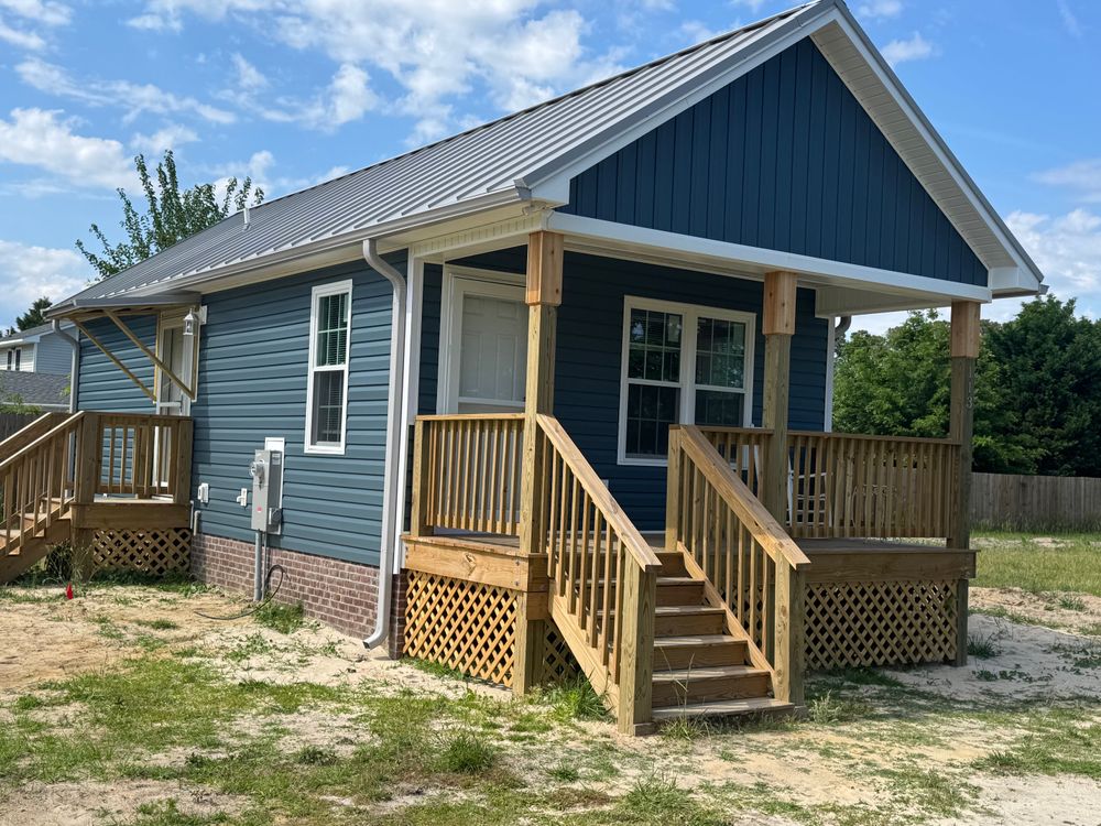 Our new home construction service offers personalized designs, expert craftsmanship, and efficient project management to create your dream home with quality and attention to detail from the ground up. for Holland Builders in Jacksonville, NC