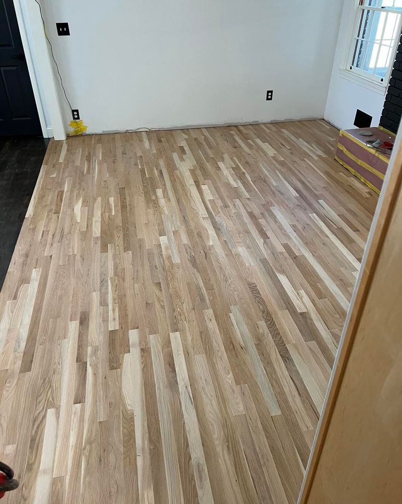 Our Laminate Flooring service offers durable and stylish flooring options for your home, providing a cost-effective solution that is easy to clean and maintain, enhancing the beauty of your living space. for Go With The Grain Flooring LLC  in Walton ,  GA