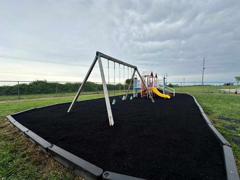 Enhance your garden's health and appearance with our expert mulch delivery and installation service, providing an efficient solution to protect your plants while improving soil quality throughout your landscape. for Elite Lawn Care Solutions in Leavenworth, KS