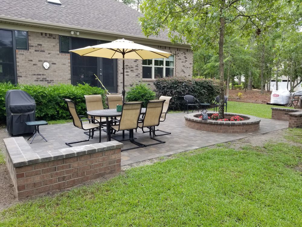 Transform your outdoor space with our expert Outdoor Living & Fire Appliances service, offering custom-designed fire pits and features that enhance ambiance, warmth, and functionality for year-round enjoyment of your backyard. for Bianchi Business Development in Southport, NC