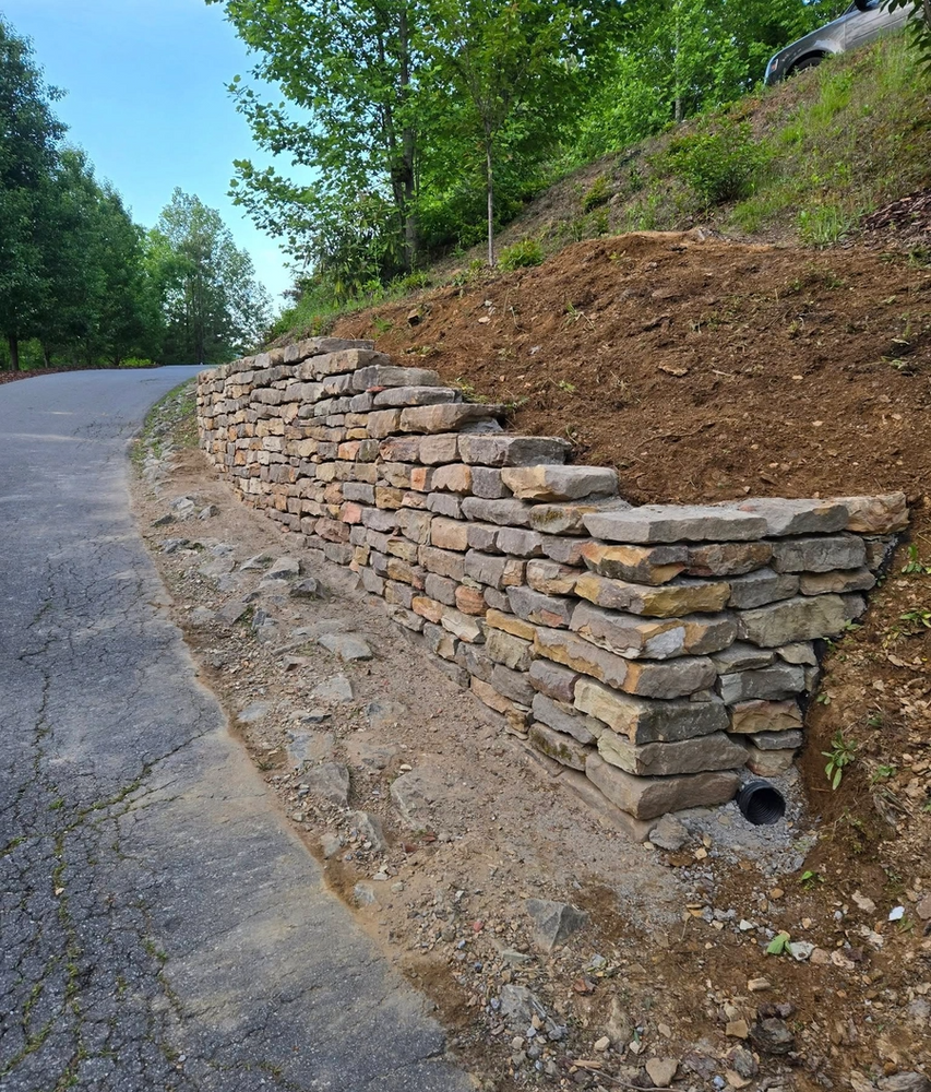 Our retaining wall construction service ensures durability and beauty, enhancing your landscape by preventing erosion and creating usable outdoor spaces tailored to your home's aesthetic. Transform your yard with expert craftsmanship today. for C4 TrueVision Renovations in Asheville, NC