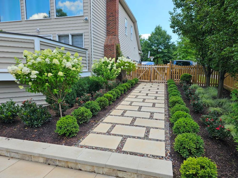 Enhance your home's curb appeal with our custom sidewalks & walkways, offering durable, aesthetically pleasing pathways that blend seamlessly into your landscaping while providing safe and functional access throughout your property. for M&M Professional Landscaping in Sterling, VA