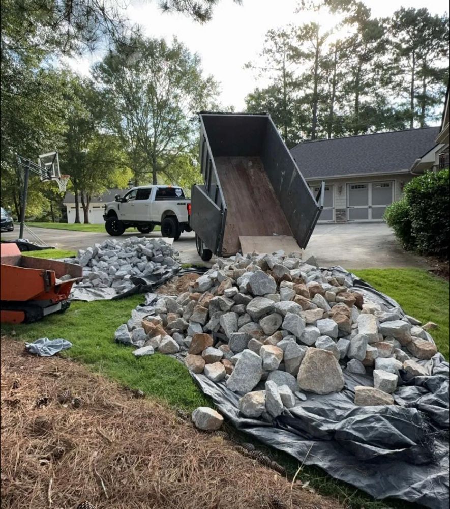 Enhance your outdoor space with our Rock Bedding service, offering durability and aesthetic appeal. We expertly install various stone types to create clean lines and natural beauty in your landscape design. for Jameson’s Landscaping & Pressure Washing in Eatonton, GA