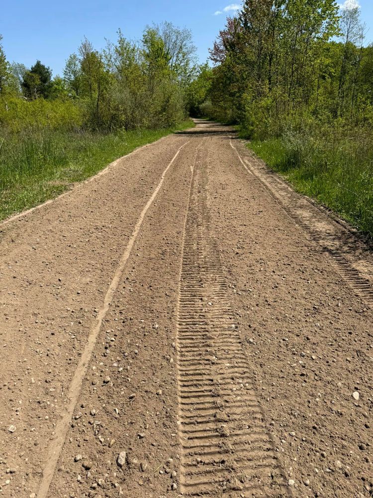 Our Private Road Grading service ensures your road is smooth, safe, and well-maintained. Trust us to enhance accessibility and prevent damage with our expert excavation solutions tailored to homeowners' needs. for NC Dirt Works in Kingsley, MI