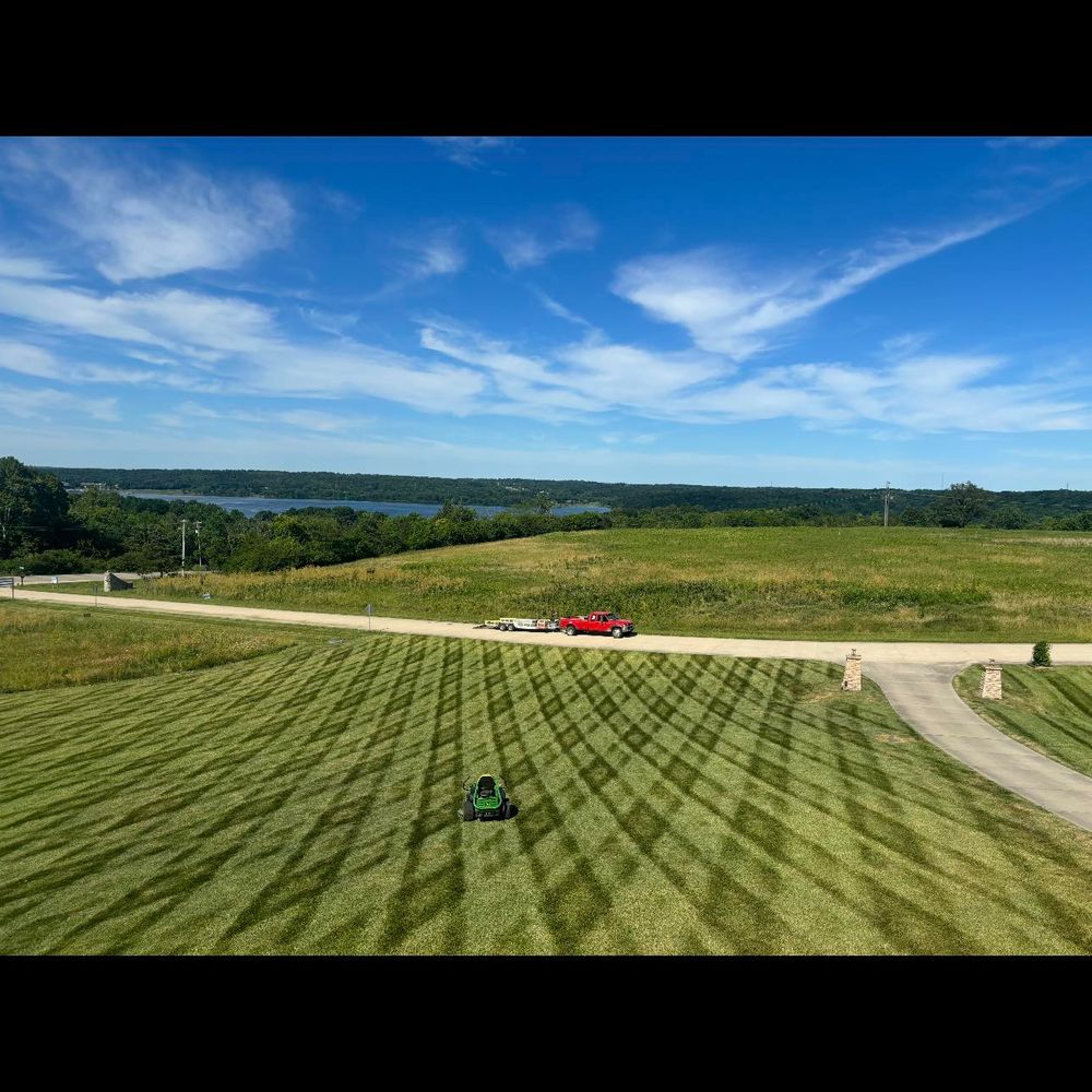 Our comprehensive mowing service ensures a perfectly manicured lawn, enhancing your home's curb appeal with precision trimming, regular maintenance, and attention to detail for lush and healthy grass. for Chapmans Lawncare and Landscaping in Connersville, IN