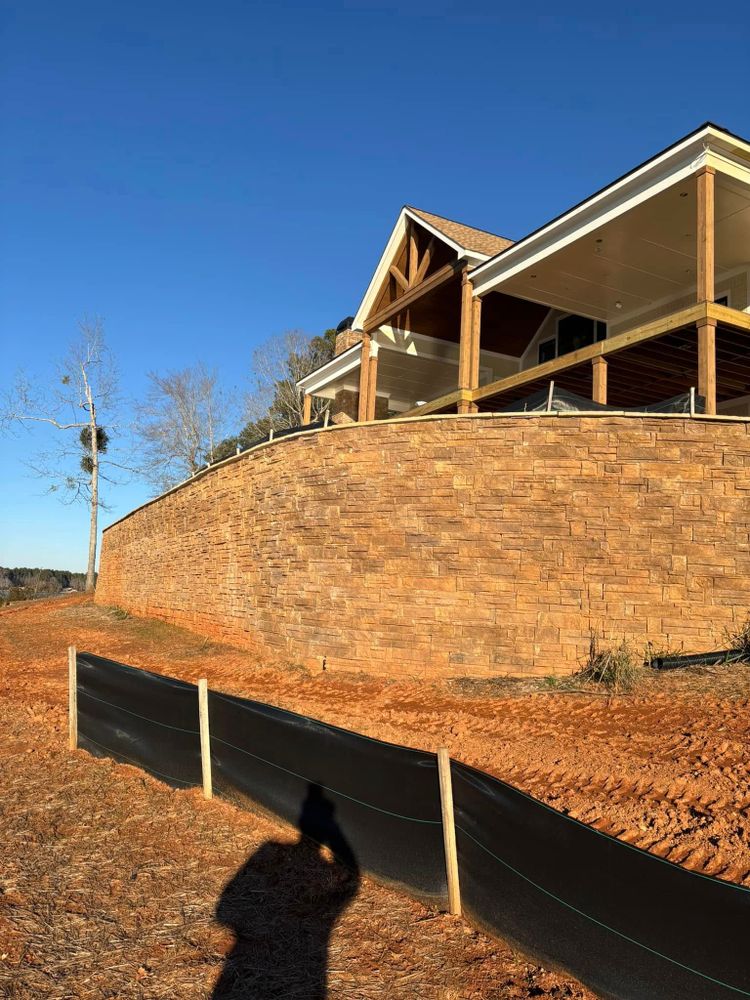 Enhance your outdoor space with our Segmental Retaining Walls service, offering durable and stylish solutions to prevent soil erosion while adding aesthetic appeal and functional structure to your landscape design. for Lawn Pro Landscape in Milledgeville, GA