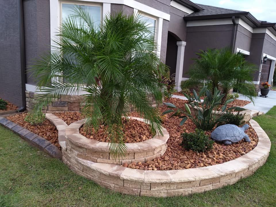 Enhance your garden's beauty and health with our professional mulch installation service, which helps retain moisture, suppress weeds, and enrich the soil for a thriving landscape year-round. for J and E LAWN Landscaping in Gainesville, Florida