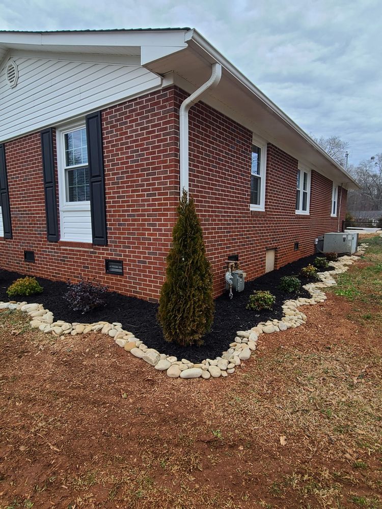 Our Mulch Installation service offers a cost-effective and sustainable solution to improve the appearance of your landscaping, suppress weeds, retain moisture in the soil, and promote healthy plant growth. for Paradise Landscaping and Tree Service in Greenville, SC