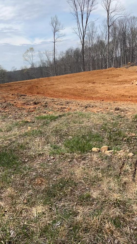 Our Leveling service ensures your land is precisely graded for construction, promoting stability and preventing drainage issues. Trust our experts to create a solid foundation for your next home project. for Double V Services in Dickson, TN