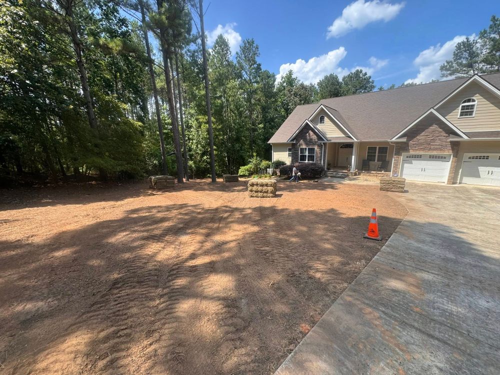 Our Leveling service provides precise site preparation, ensuring a stable and even foundation for your construction project by skillfully adjusting the ground surface to accommodate any building or landscaping plan. for Veteran Land Management in Greenwood, SC