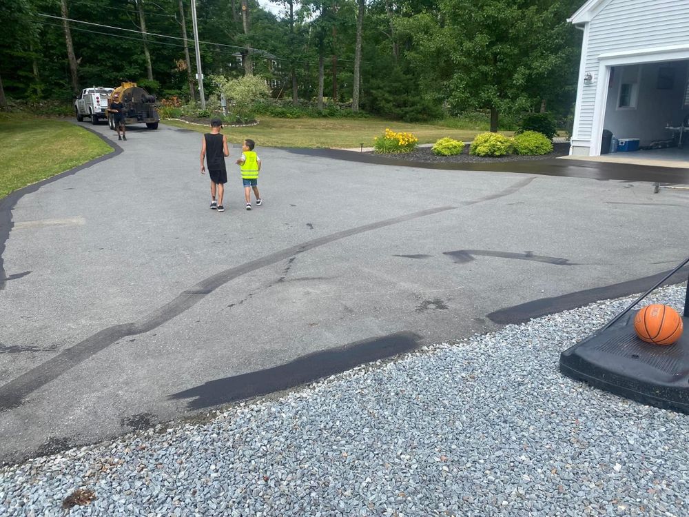 Our Patching service provides homeowners with efficient, durable solutions for repairing cracks and potholes in asphalt surfaces, ensuring a smooth and safe driveway that enhances the property’s curb appeal. for Aldrich & Sons Asphalt Services in Lowell, MA