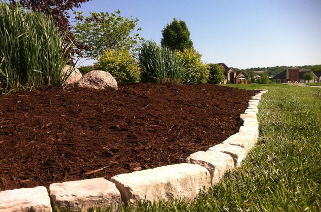 Enhance your garden's health and appearance with our expert mulch delivery and installation service, providing an efficient solution to protect your plants while improving soil quality throughout your landscape. for Elite Lawn Care Solutions in Basehor, KS