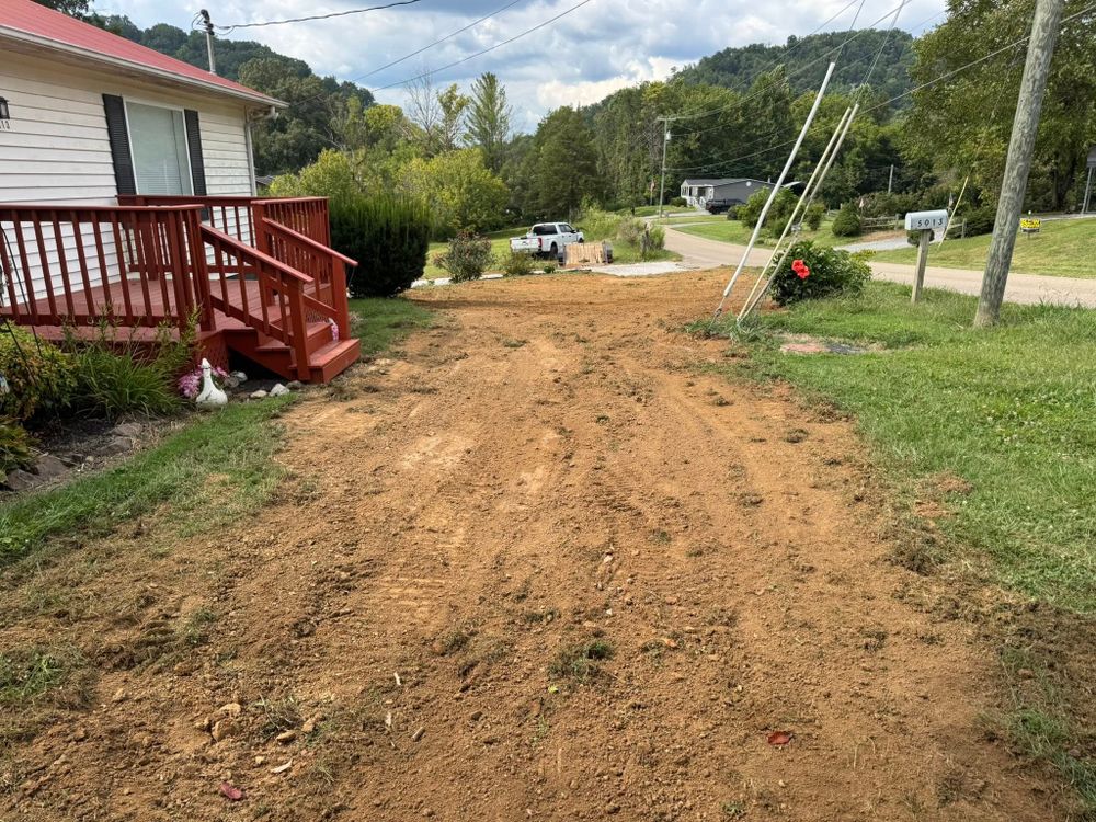 Our land grading service employs an advanced grading system to ensure your property is perfectly leveled, promoting effective drainage and providing a solid foundation for future landscaping projects. for S&M DIRT TECH LLC in Knoxville, TN