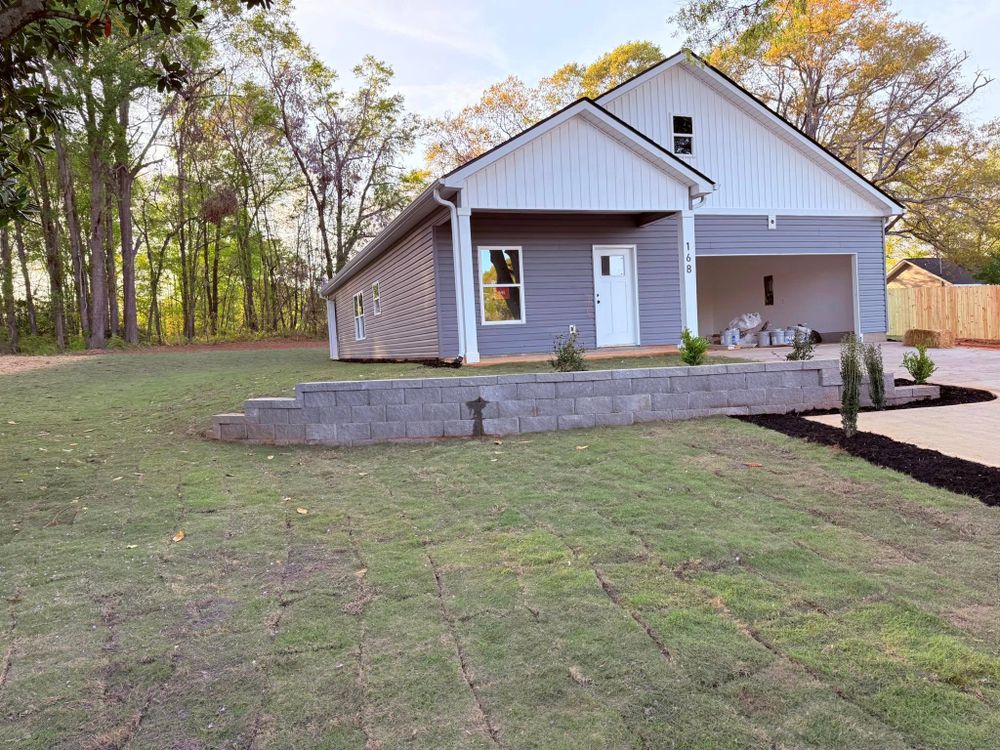 Enhance your landscape with our expert Retaining Walls service, providing stability and aesthetic appeal to your property while preventing soil erosion, maximizing usable space, and enhancing drainage efficiency. Transform your outdoor living area today! for Rainman Pro Irrigation and Landscape LLC in Lyman, SC