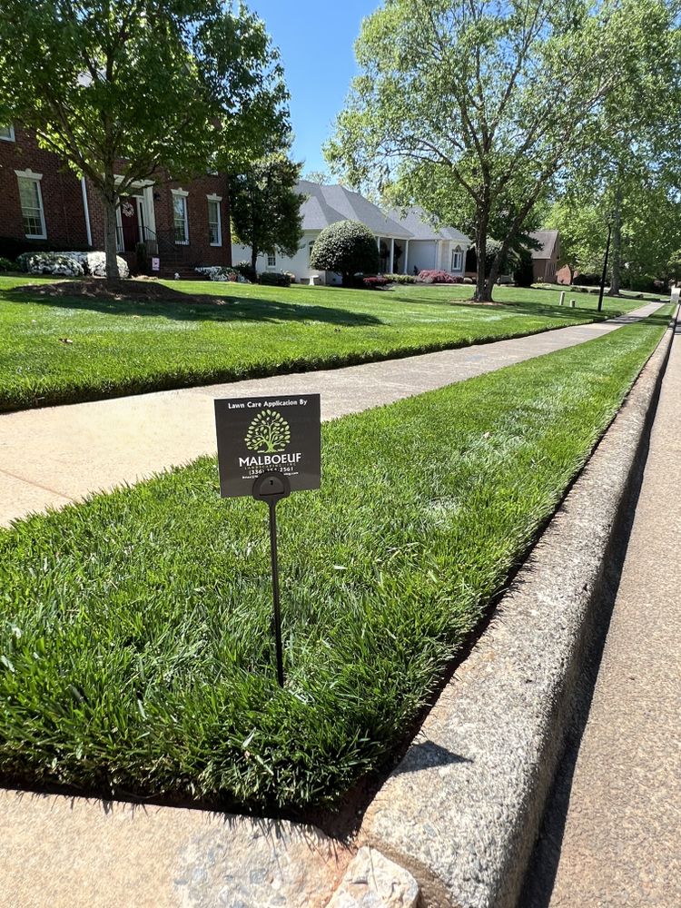 Our Fertilization and Weed Control Programs ensure your lawn thrives year-round by providing essential nutrients and effective weed management. Enjoy a lush landscape with expert care tailored to your lawn's specific needs. for Malboeuf Landscaping, Inc in Kernersville, NC