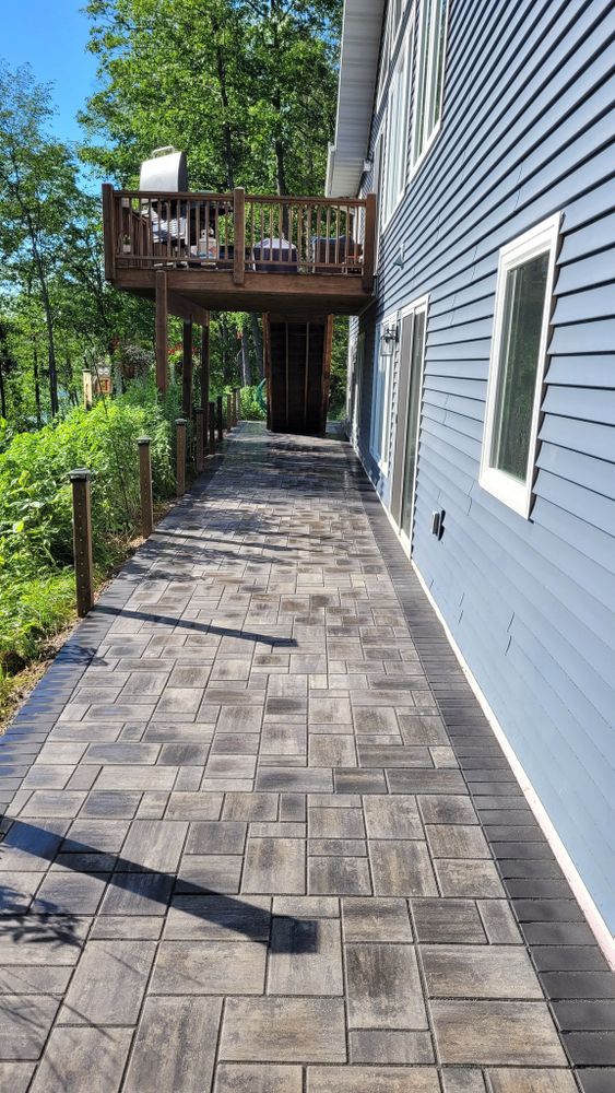 Our Sidewalk Construction service creates safe, durable, attractive walkways that enhance your landscape, improve accessibility, and boost curb appeal with expert planning, quality materials, and precise installation tailored to your home. for Alpine Landscaping Northwoods LLC in Rhinelander, WI
