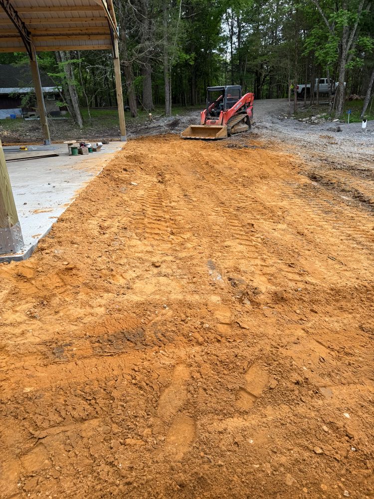 Our Land Grading service expertly levels and prepares your property, ensuring a stable foundation for construction projects, enhancing drainage efficiency, and improving landscape aesthetics for a flawless finish every homeowner will appreciate. for Grit and Gravel in Lafayette, TN