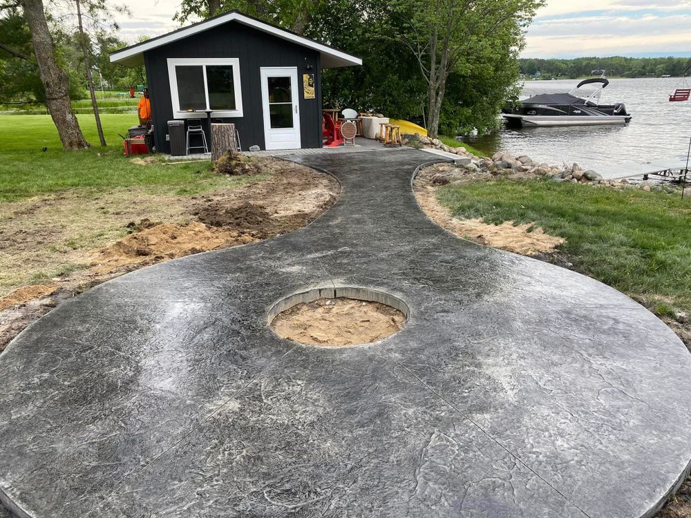 Elevate your outdoor living space with our expert Patio Design & Installation service. Our team will transform your backyard into a stylish and functional area for relaxing and entertaining guests. for Mccoy Concrete Inc.  in Buffalo, MN