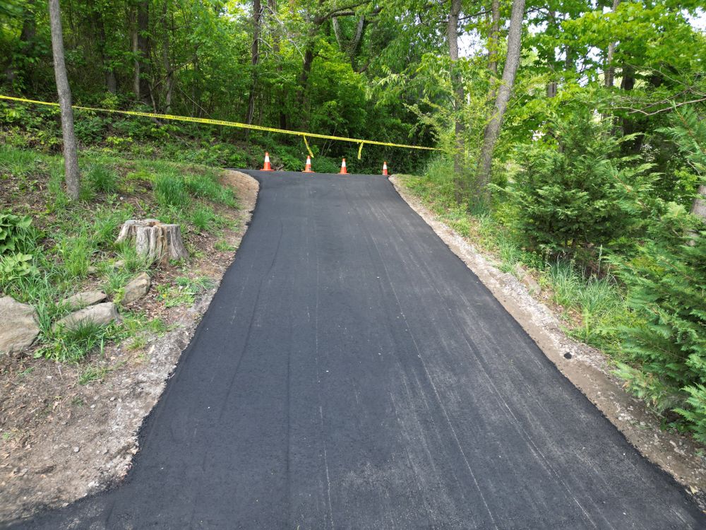 Our asphalt paving service creates smooth, durable driveways and surfaces that enhance curb appeal, improve safety, and withstand daily use. We deliver reliable workmanship with clean results built to last. for JV Hardscape & Construction Inc in Hendersonville, NC