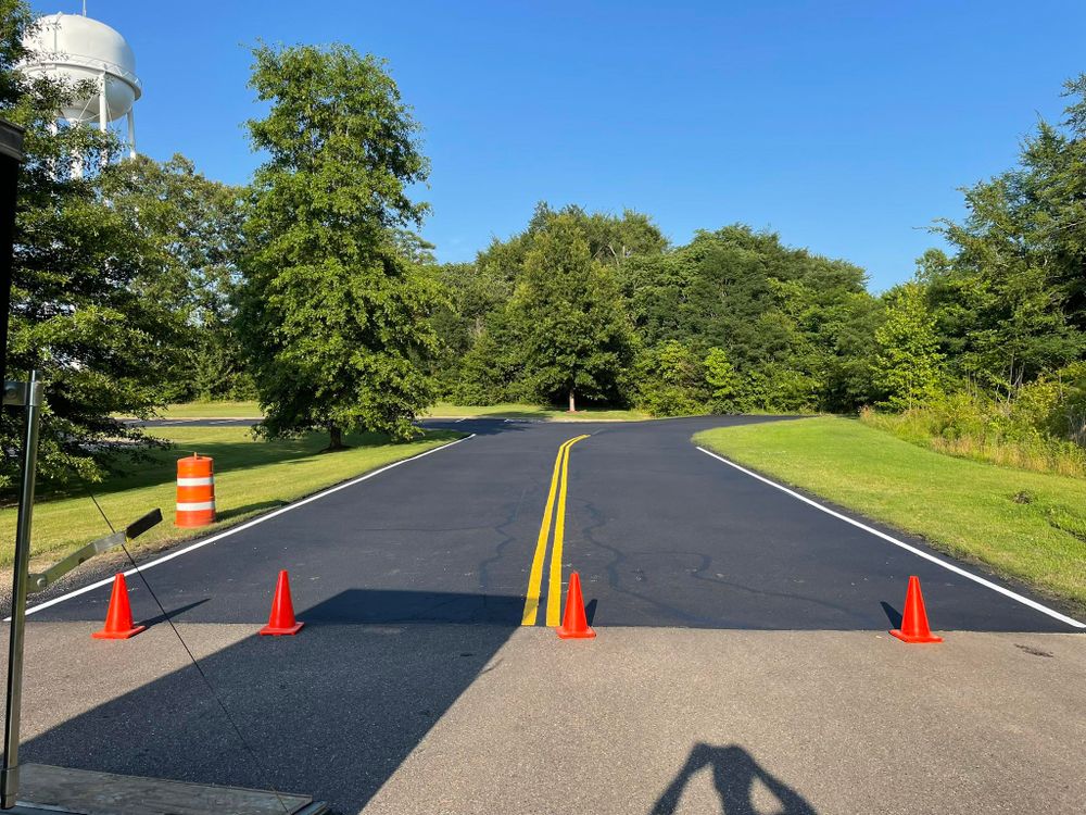 Improve your home's curb appeal with our professional asphalt installation service, offering durable and smooth surfaces designed to withstand time and weather while enhancing safety and aesthetics. for Elite Sealing & Striping in Jackson, TN