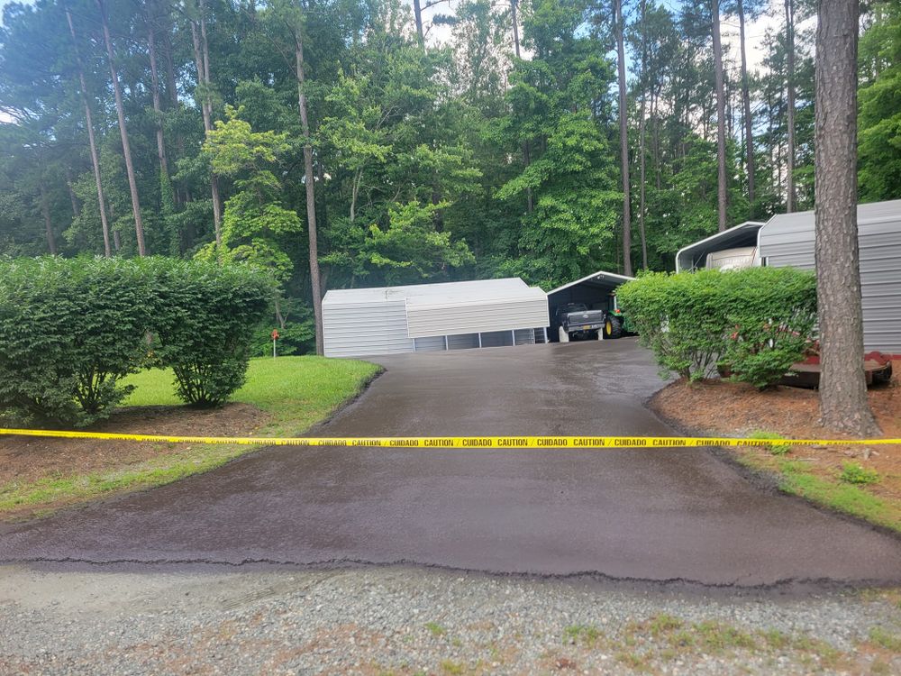 Our Asphalt Maintenance service ensures your driveway stays in top condition, preventing cracks and deterioration through expert sealing, patching, and regular upkeep to enhance longevity and curb appeal for your home. for CJ's Paving and Sealcoating in Lynchburg, VA