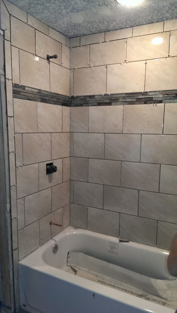 Our Tile service offers expert installation and design solutions, transforming your spaces with a stunning variety of quality tiles, ensuring durability and elegance to enhance the beauty of your home. for Camo Specialty Construction LLC in O'Neill, NE