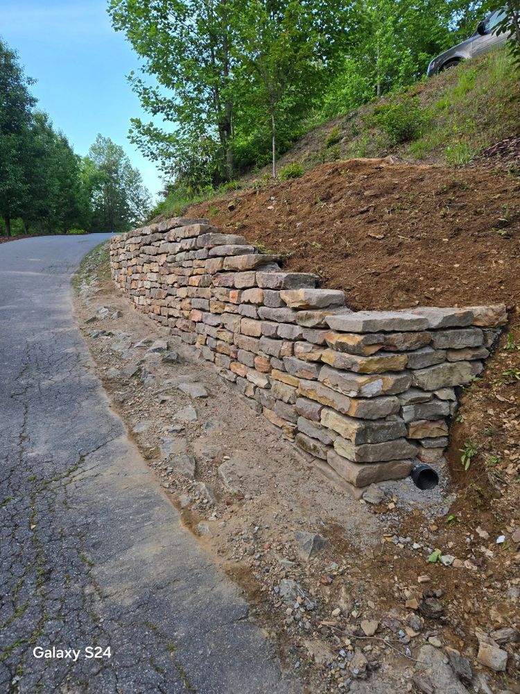 Our retaining wall construction service ensures durability and beauty, enhancing your landscape by preventing erosion and creating usable outdoor spaces tailored to your home's aesthetic. Transform your yard with expert craftsmanship today. for C4 TrueVision Renovations in Asheville, NC