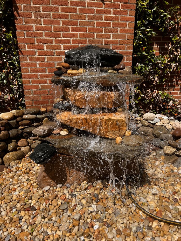Enhance your outdoor space with our custom water features, expertly designed to provide tranquility and elegance, transforming your garden into a serene oasis that reflects both beauty and style. for Massey Landscaping in Gastonia, NC