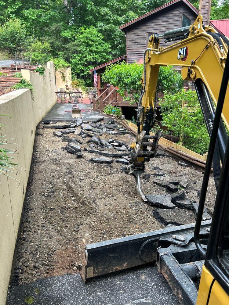 Our concrete and asphalt tear-out service efficiently removes old or damaged surfaces, preparing your property for a fresh installation. We ensure minimal disruption and leave the site clean and ready for new paving. for The Gravel Guy in Blairsville, GA