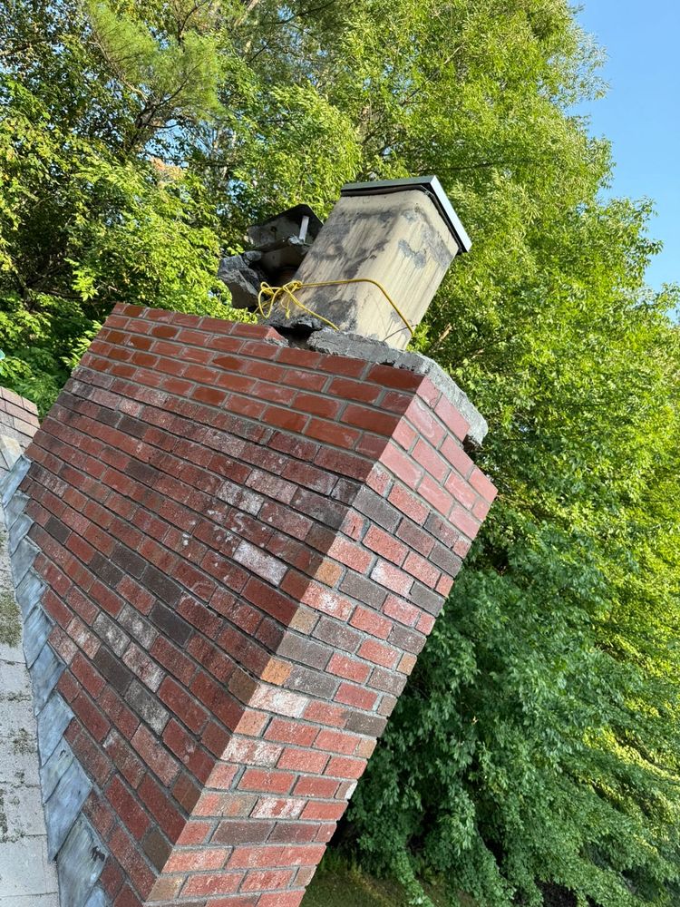 Our Chimney Rebuild service ensures the structural integrity and safety of your chimney by expertly rebuilding it with high-quality materials to protect your home from potential hazards. for Boston Elite Roofing & Masonry in Somerville,  MA