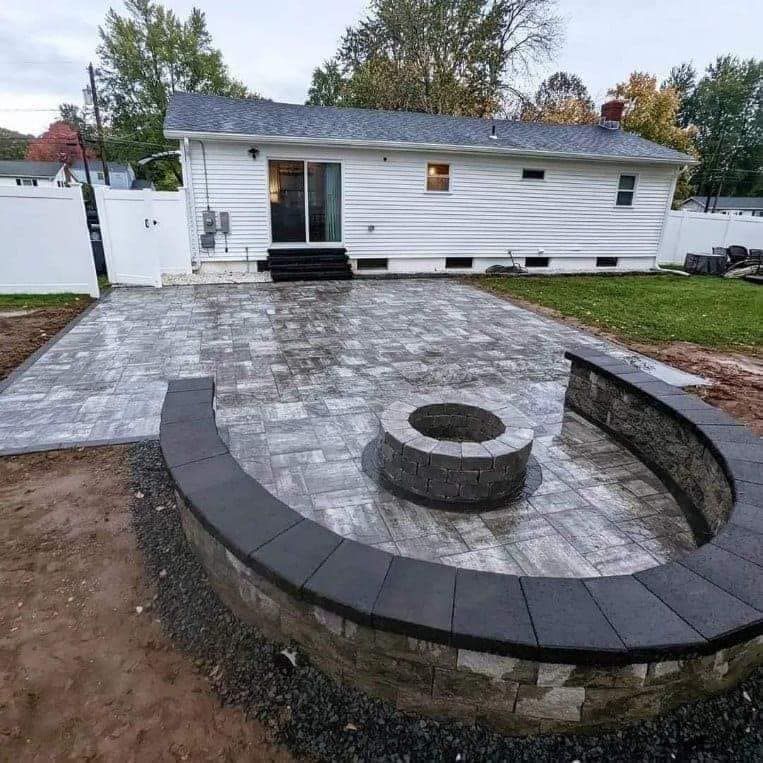 Our retaining wall construction service enhances your property's stability and aesthetics by expertly building durable, customized walls that prevent soil erosion while seamlessly blending with your landscape's design. for Elite Pavers and Fencing in Springfield, MA