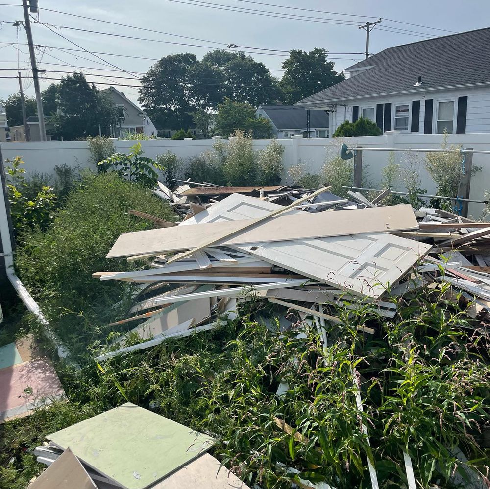 Our demolition services offer homeowners a hassle-free solution to safely and efficiently remove unwanted structures or buildings from their property, providing a seamless transition for new construction or renovation projects. for Prime Ape Junk Removal & Hauling in Warwick, RI