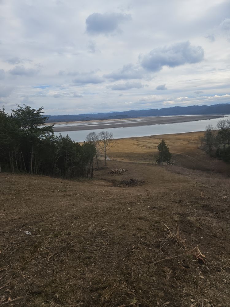 Our Forestry Mulching service efficiently clears overgrown vegetation, turning it into mulch in place. This eco-friendly method enhances land management by improving soil health and ensuring a clean, debris-free property environment. for Bledsoe & Sons Excavating and Developing in Dandridge, TN