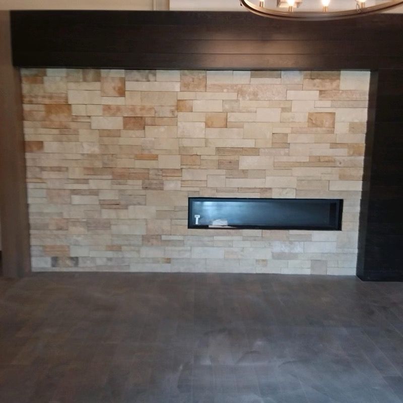 Our Fireplace and Stone on Chimney service offers expert installation of stunning stone veneer, enhancing the beauty and functionality of your fireplace and chimney for a cozy home retreat. for CSR Tile Construction in Fridley, MN