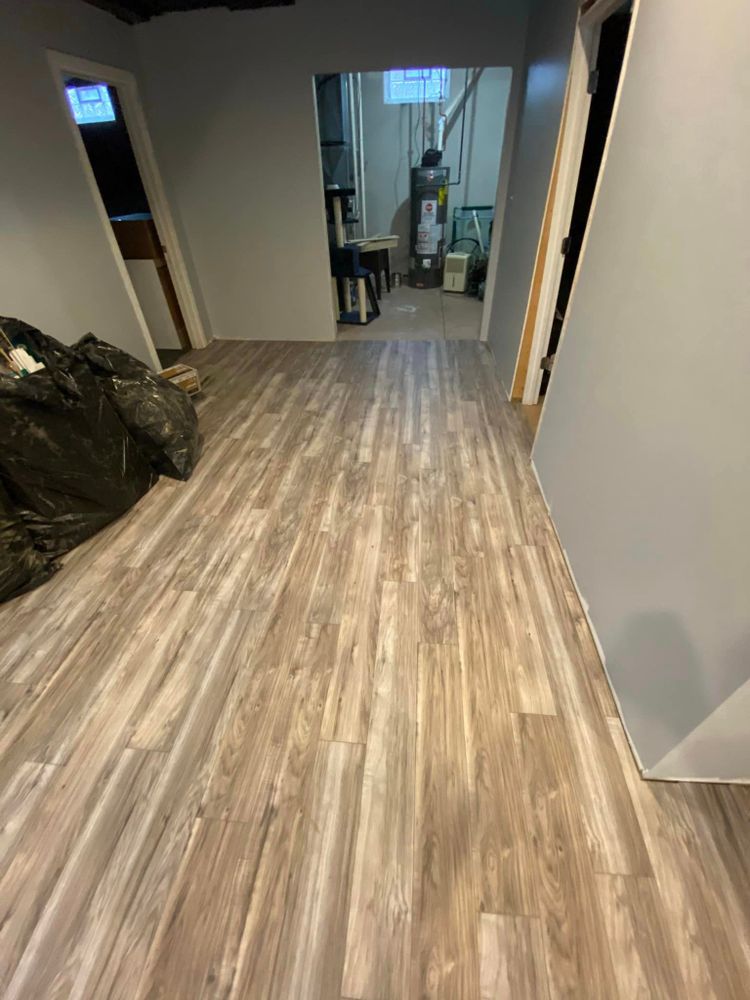 Our laminate flooring service offers a durable and cost-effective solution for homeowners looking to enhance the aesthetics of their living spaces with high-quality, easy-to-maintain flooring options. for Reyna’s Flooring & Trim Carpentry  in Allen PArk, MI