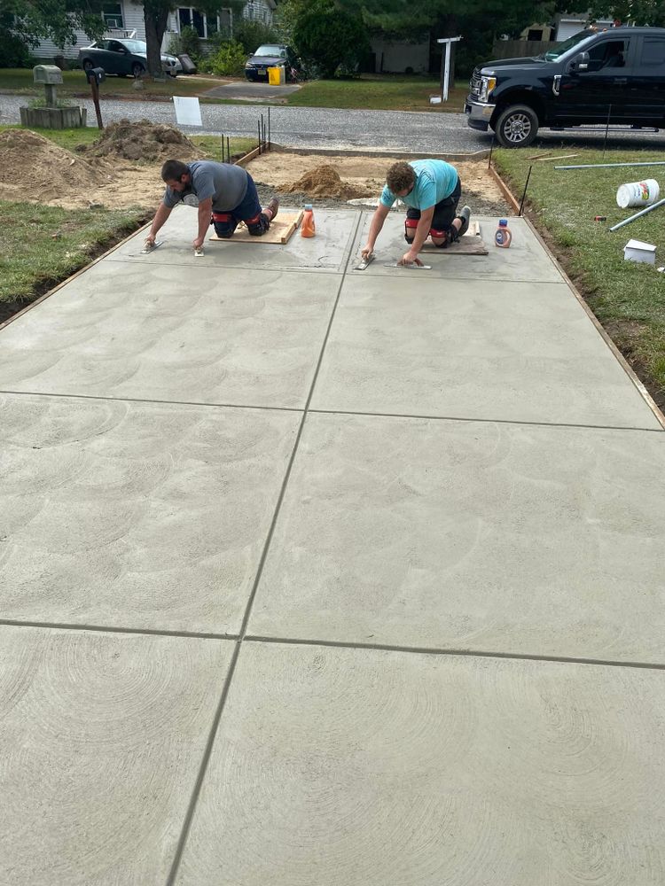 Enhance your home's curb appeal with our expert driveway construction service, seamlessly blending functionality and aesthetics. Trust our skilled team for superior patio design & construction tailored to your unique style preference. for Two Moose Masonry in Cape May County, NJ