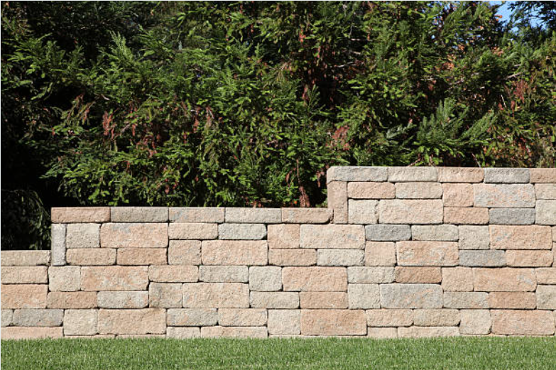 Enhance your outdoor space with our Retention Walls service, providing durable and stylish solutions that prevent erosion, increase stability, and seamlessly integrate into your landscape design for a stunning finish. for SmithWorx Construction in Charleston, SC