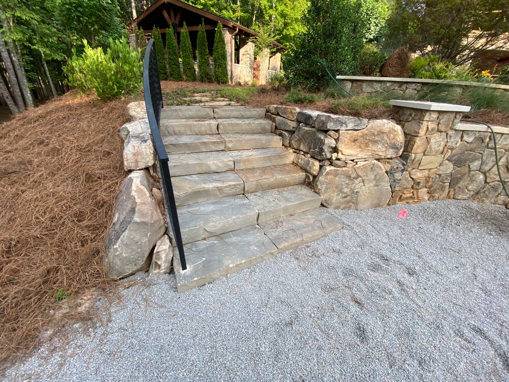 Transform your outdoor space with our expert hardscaping services, featuring beautiful natural stone hardscape designs. Enhance functionality and aesthetics while adding lasting value to your home's landscape. for JAD LANDSCAPE LLC in Conyers, GA