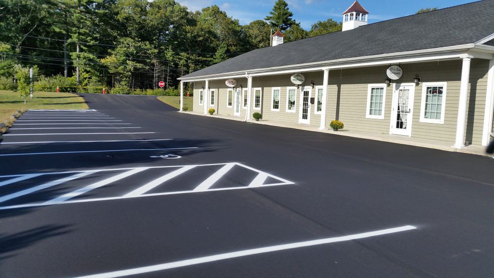 Our Asphalt Parking Lot Construction service offers homeowners durable, smooth surfaces with expert installation, ensuring long-lasting quality and curb appeal for residential driveways or private home parking areas. for AM Sealers in Griswold, CT