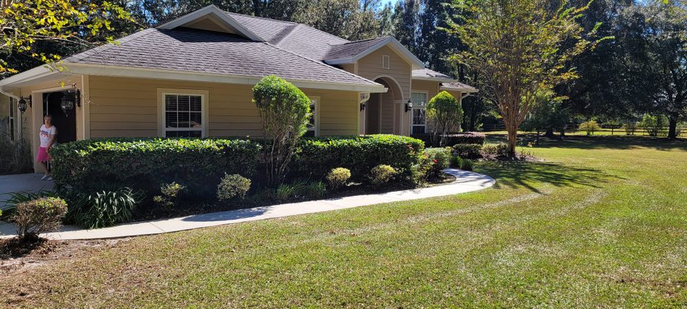 Enhance your home's curb appeal with our expert shrub trimming service, designed to shape and maintain the health of your plants, ensuring a neat and welcoming outdoor space year-round. for Tyson’s Full Service Lawn Care in Starke, FL