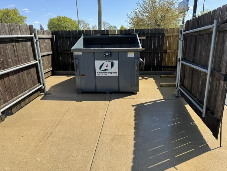 The Lot Doctor's dumpster pad cleaning service ensures a clean, odor-free environment by expertly removing dirt, grime, and bacteria buildup from your dumpster area, enhancing hygiene and extending the life of your property. for The Lot Doctor in Seminole County, OK