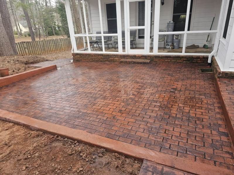 Discover what is concrete in a transformative way with our stamped concrete service, offering homeowners enduring beauty and durability for patios, driveways, and walkways that mimic high-end materials. for WCDI - We Can Do it Design & Build in Sharpsburg, GA