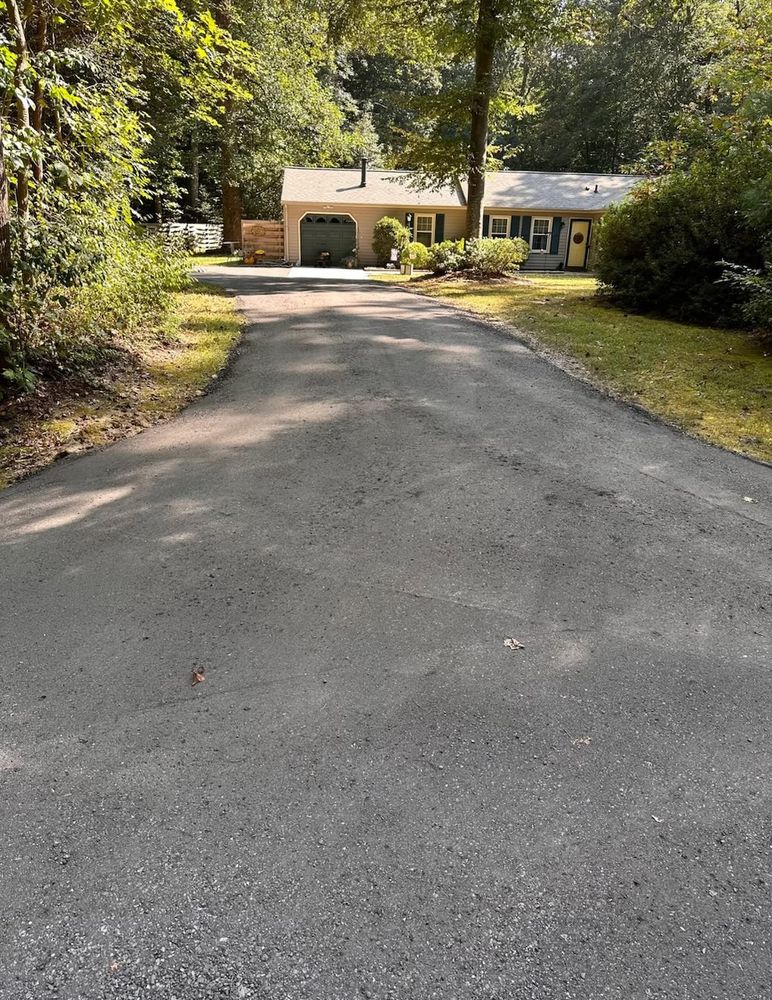 Transform your home's entrance with our driveway design & build service, offering custom solutions that combine aesthetics and functionality to enhance curb appeal while providing durable, high-quality craftsmanship. for Lewis Oaks Landscaping in King and Queen County, VA