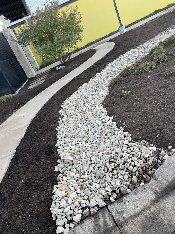 Enhance your outdoor space with our River Rock & Gravel Installs, offering durable and stylish solutions for pathways, gardens, or accents that improve drainage and complement any landscape. for Magnolia Landscape & Design in Aledo, TX