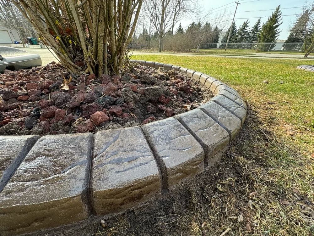 Enhance your home's curb appeal with our expert Curbing and Landscape Borders service, providing durable, stylish concrete solutions that define and beautify garden edges for an attractive, low-maintenance outdoor space. for Curb Concepts Plus in Mishawaka, IN